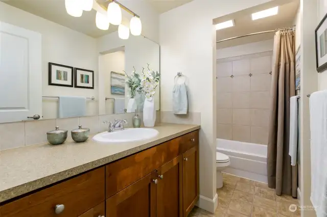 Bathroom with separate  toilet and bath space.