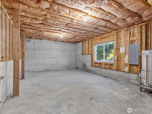 Unfinished lower level has plenty of light with large windows.