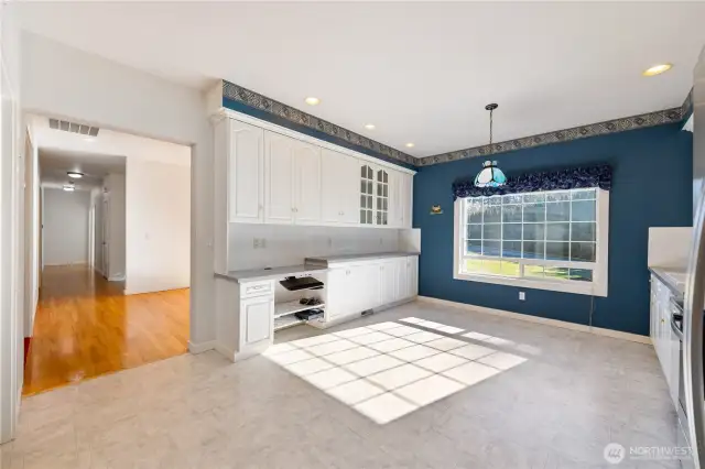 Other side of the spacious kitchen.  Lots of storage plus a built-in desk.