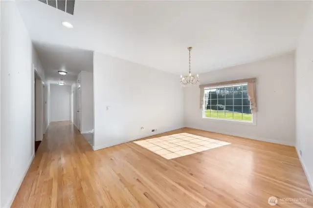 Between the entry & the kitchen is the roomy formal dining room.  Lovely hardwood floors