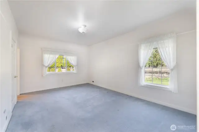 Primary bedroom has room, a walk-in closet plus an addition regular closet plus a linen closet. Storage galore!
