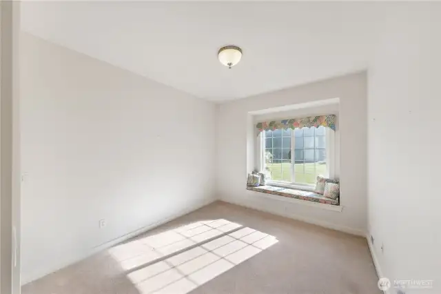 One of the other 2 guest bedrooms w/ window seat