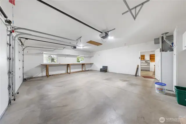 Extra deep finished 2 car garage. Pull-down ladder to attic storage