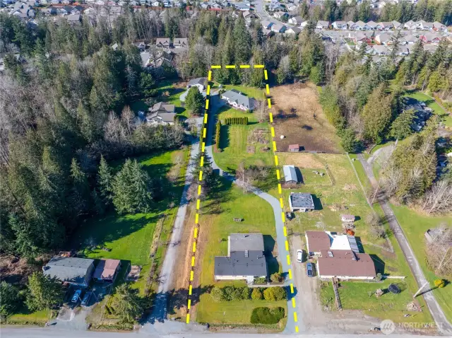 This shows the Manuf. Home in front & the custom built home in the back.
