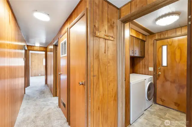 Newer carpeting down the hall.  Washer & dryer included in sale. Door to the covered breezeway to garage, etc