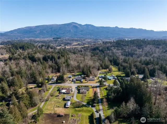 Another view of the Manuf. Home on the right w/ the driveway to the main custom-built home