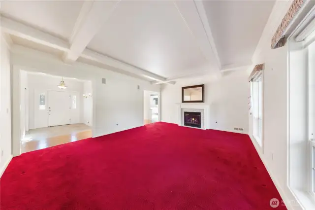Formal front entry opens to the spacious living room w/boxed ceiling features as well as a gas fireplace