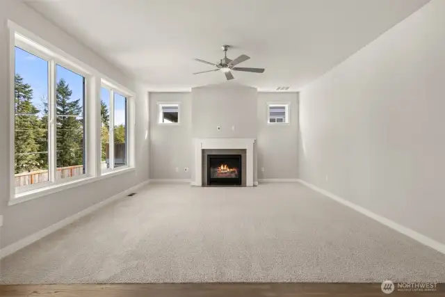 Living room with gas fireplace. Photos of a similar home, not actual, for illustration only.