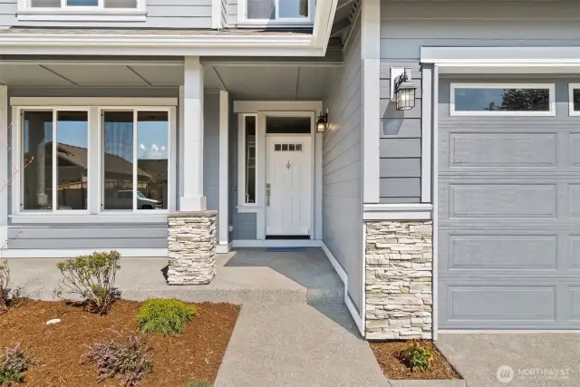 Stone panels on home & garage. Photos of a similar home, not actual, for illustration only.