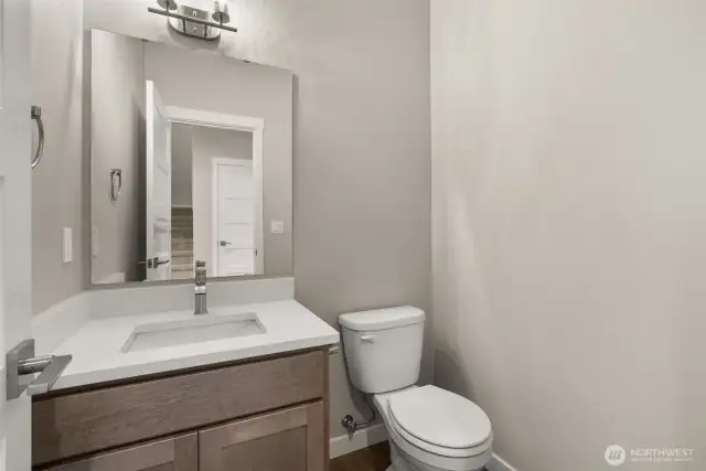 Half bath main level.  Photos of a similar home, not actual, for illustration only.