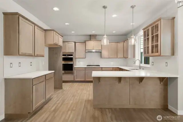 Maple cabinetry with full extension guides and soft close drawers. Photos of a similar home, not actual, for illustration only.