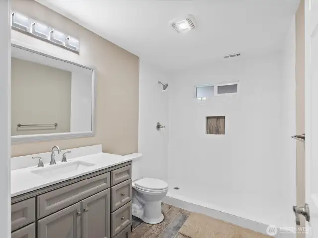Refurbished 3/4 bath on ground level next to fam rm.