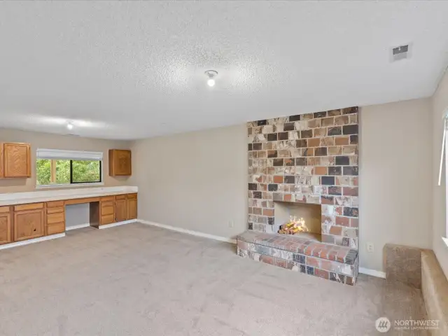 Fam rm w/ wood fireplace.
