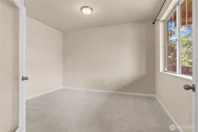 Downstairs den with French doors
