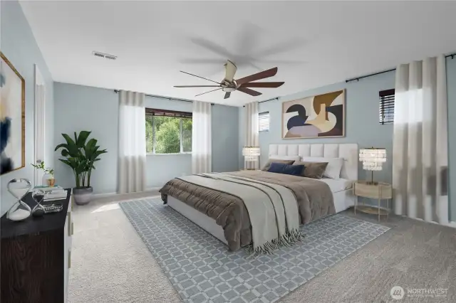 Spacious primary bedroom looks over the back yard for extra privacy. No neighbors behind you!