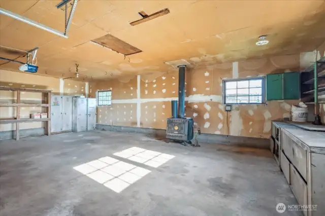2 car garage with tons of storage space and fireplace