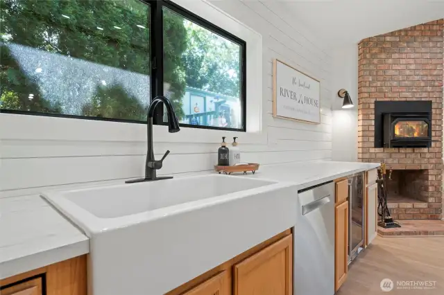 Paired with crisp cabinetry, polished countertops, and sleek fixtures, the sink blends farmhouse warmth with upscale finishes