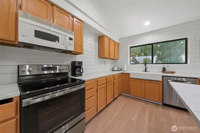 Clean lines, premium, easy-care materials, and integrated lighting help create a polished chef-ready space
