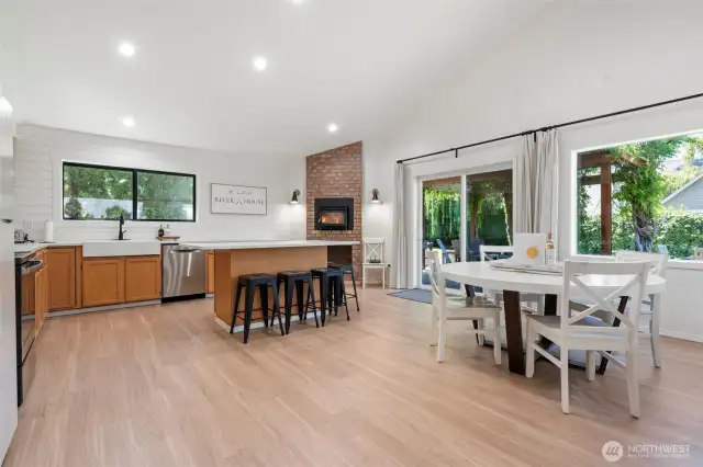 Enjoy a crackling fire in the kitchen’s authentic brick-surround fireplace, perfect for cozy meals and relaxed gatherings around the hearth