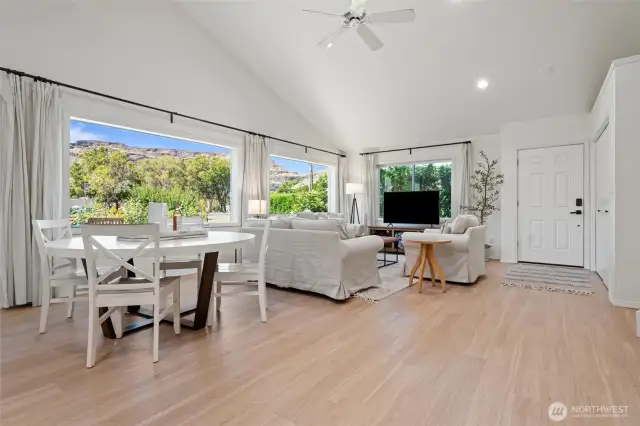 Expansive great room bathed in natural light from a stunning wall of windows