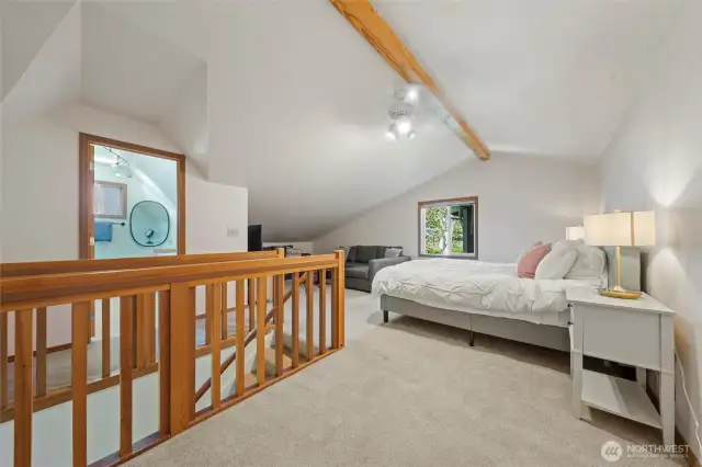 Generously sized loft bedroom featuring a full bathroom, perfect for a home office, guest suite, or private getaway within the home
