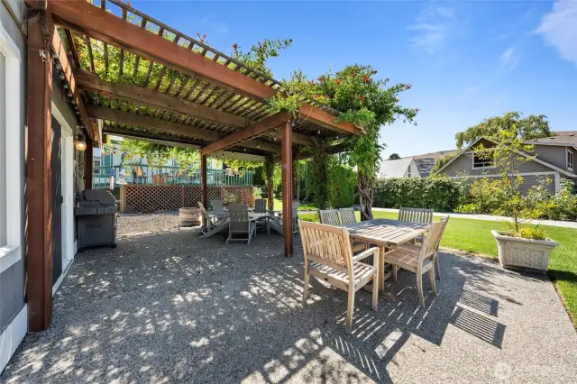 Fires up the grill, gather with friends—this vine-wrapped gazebo on a large backyard patio is the entertaining hub for cocktails, BBQ dinners, and evening conversations