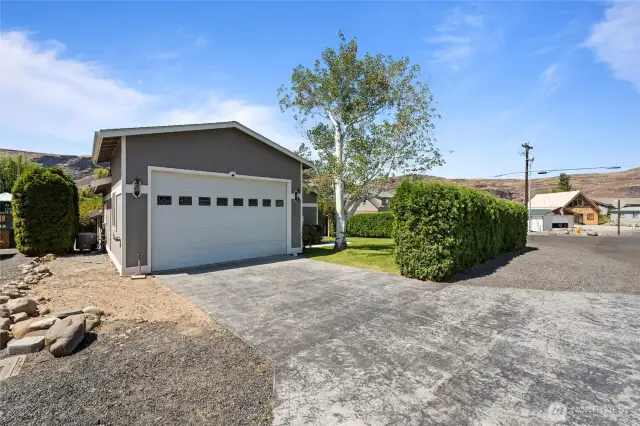 Spacious garage offering room for vehicles, gear, and hobbies—featuring storage options and room to spare for all your recreational needs