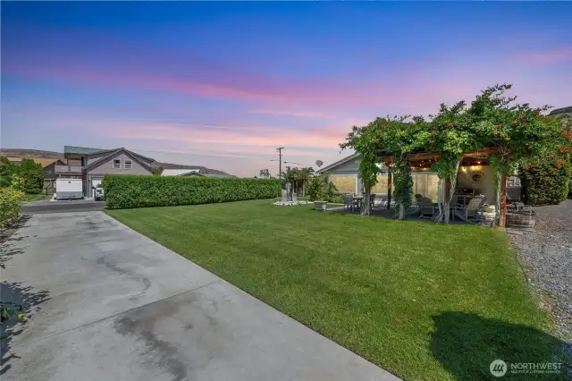 Large, landscaped yard with an RV parking pad and room for toys — ideal for guests, families, or as flexible rental space