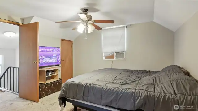 Upstairs boasts two bedrooms and guest bathroom.