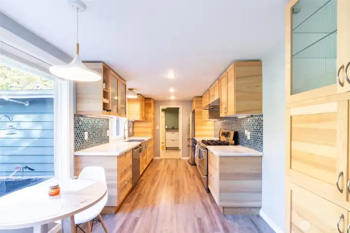 Gorgeous kitchen featuring an eat-in nook perfect for casual dining.