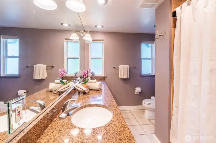 Double-sink vanity in this spacious bathroom.