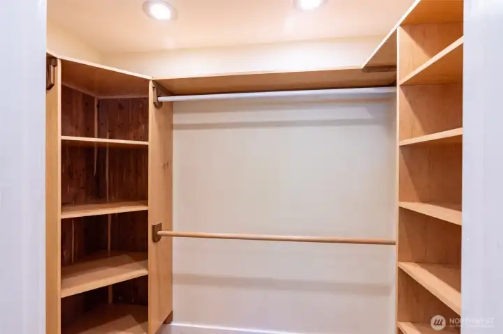 Walk-in closet with custom shelving.