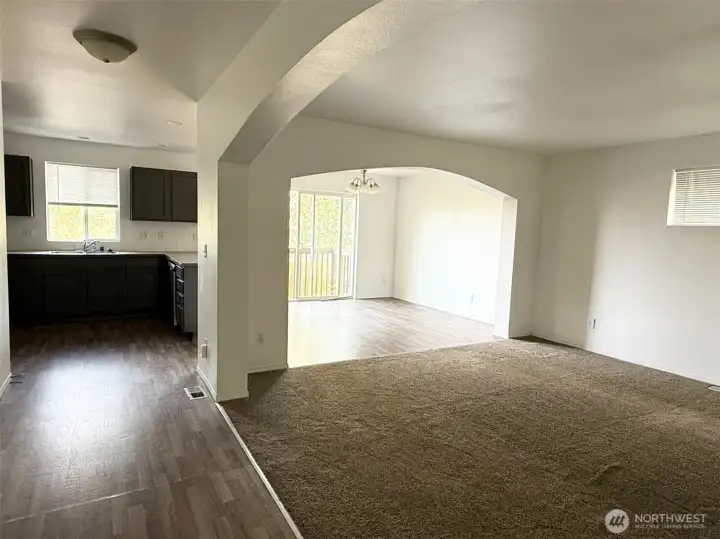Open concept living area with beautiful arches.