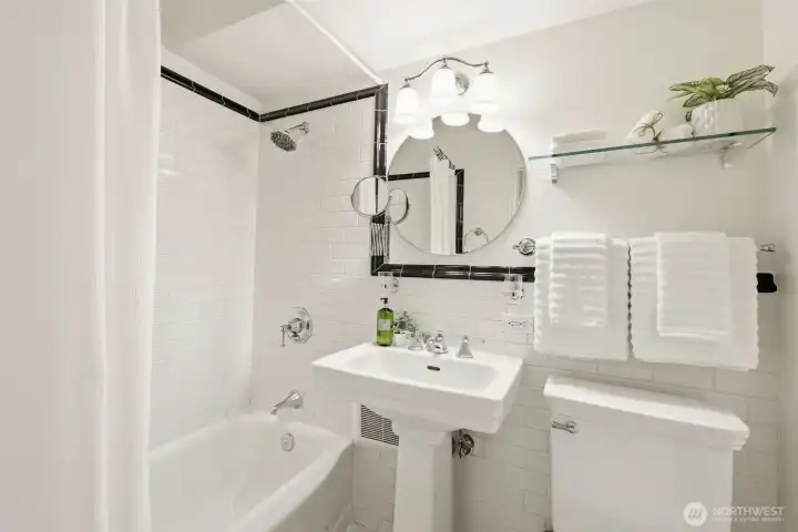 Full bathroom with reglazed bathtub