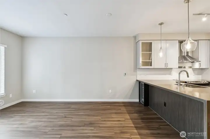 View of living room w/ kitchen