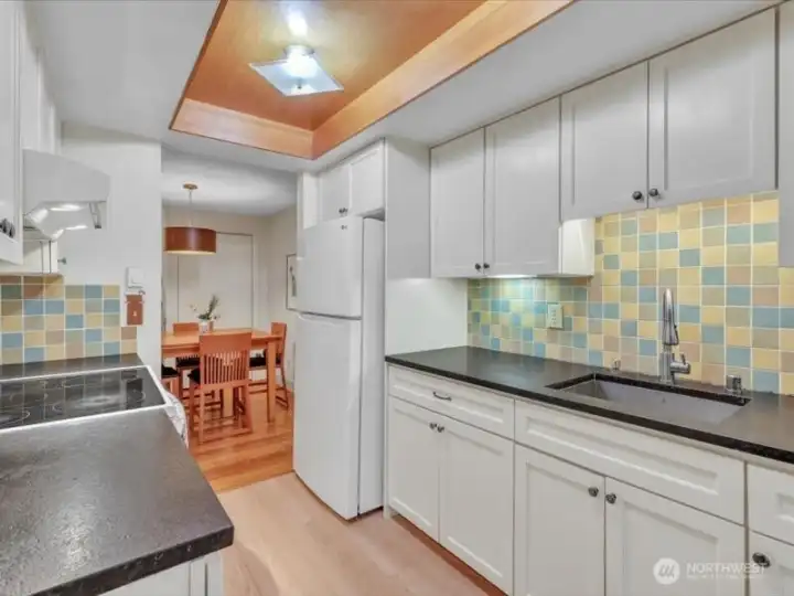 Beautiful kitchen with Granite counters and tiled backsplash. Double drop in stainless sink. All water fixtures have been updated!