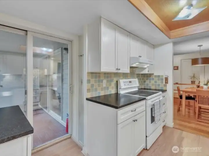 Two sliding doors to deck. Kitchen and Living room.