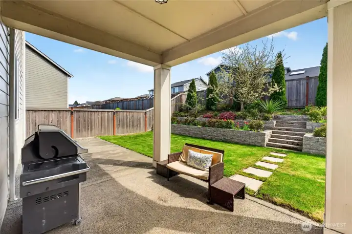 View of beautiful landscaping backyard covered patio