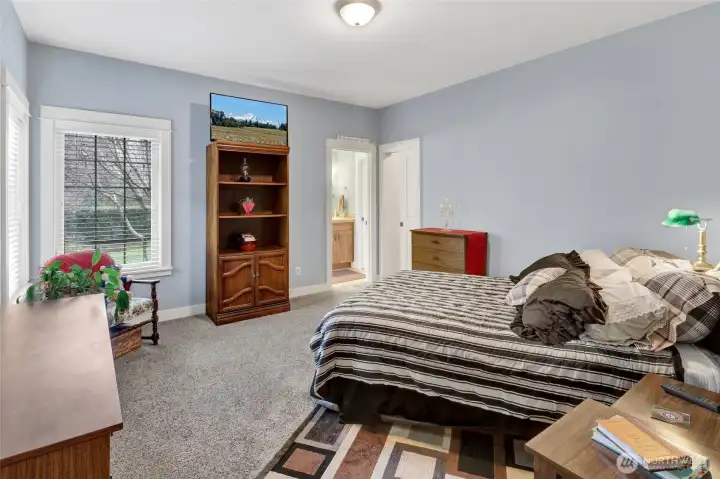 Spacious primary bedroom with lots of natural light.