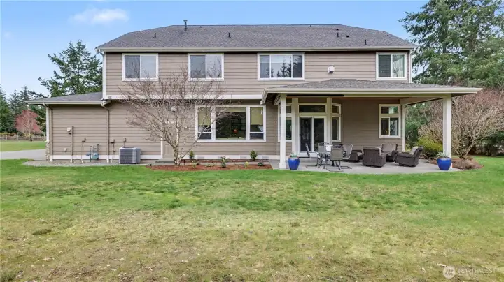 Spacious backyard with covered patio