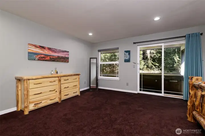 Main Bedroom with sliding glass door to outside porch.