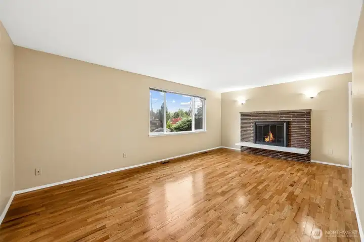 Refinished hardwood floors add warmth and character throughout the home’s main living areas.”