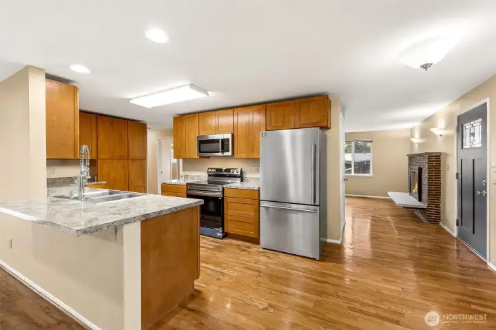 Bright kitchen with updated finishes, generous storage, and seamless flow into the dining and living areas—enhancing the home’s open feel