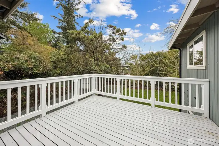 Private deck overlooking lush greenery—perfect for outdoor dining, morning coffee, or relaxing in a peaceful natural setting.”