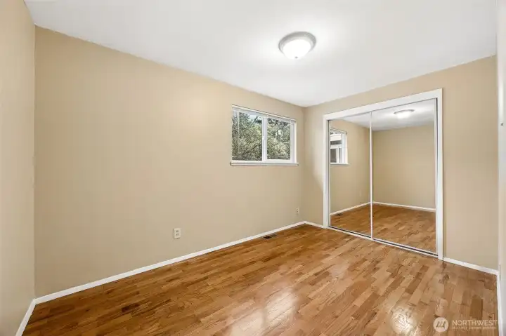 Primary bedroom features a generous layout and modern finishes, highlighting the home’s remodeled condition and comfortable living spaces.”