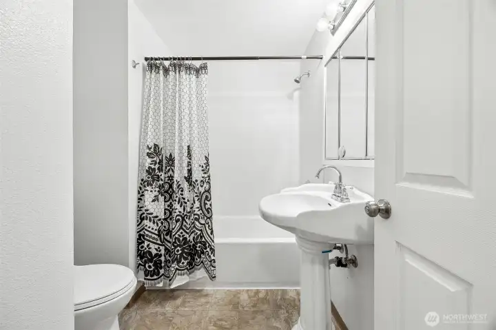 Updated full bathroom featuring modern fixtures, fresh finishes, and a clean, functional layout