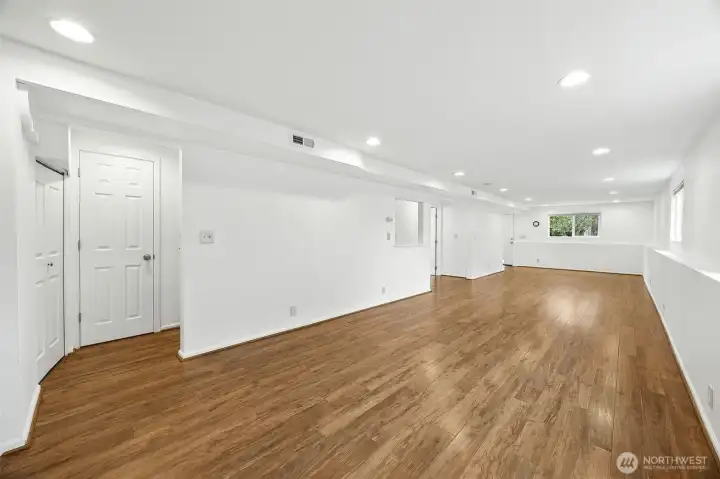 Large bonus room with hardwood floors and open layout—ideal for a home office, gym, media room, or creative workspace.”