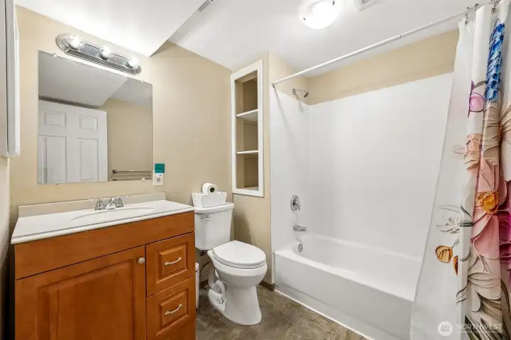 Remodeled bathroom with contemporary styling, updated vanity, and refreshed surfaces—move in ready and well maintained.”