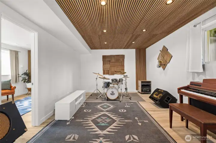 This rec room space has acoustic ceiling for sound attenuation. Great for music or studio space or just a rec room with a great vibe. Note the high ceilings.