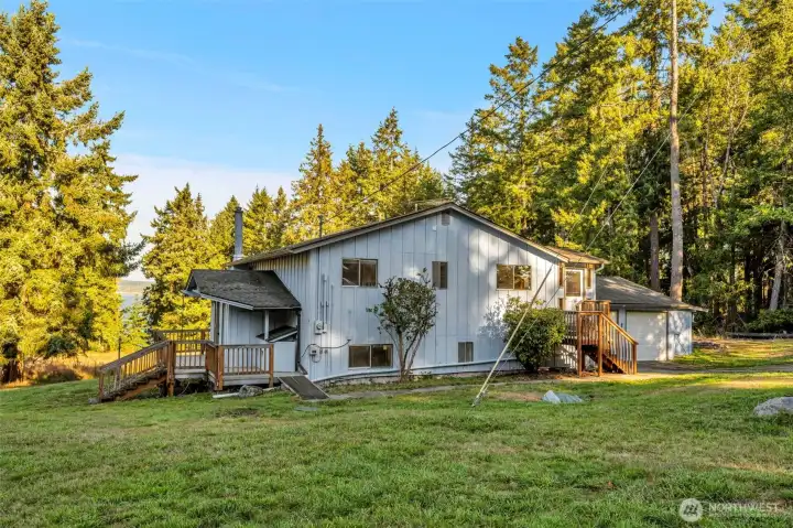 As you walk to the front door on the left, you get to see the water view in the distance